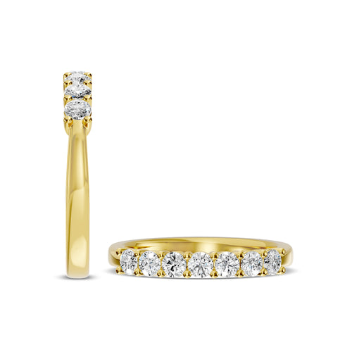 Anillo de diamantes de siete piedras de 14 KW y 0,50 quilates en engaste de canasta abovedada